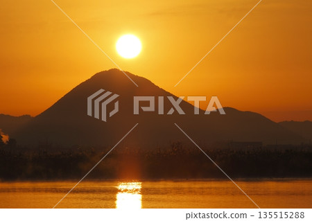Mount Mikami at sunrise as seen from Lake Kihamauchi Mount Mikami at sunrise as seen from Lake Kihamauchi 135515288