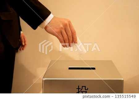 Male hand voting in an election 135515549