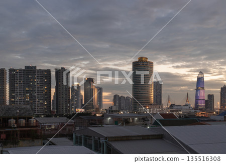 Evening view after sunset of Skyscrapers in the business district and Bhumibol Bridge. 135516308