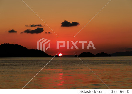 A serene evening view of the sea and island silhouettes in Yawatahama, Ehime Prefecture, dyed in the setting sun 135516638