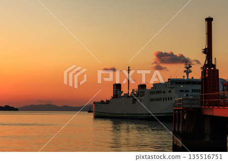 A fantastic view of Yawatahama Port in Ehime and the ferry moored there at sunset 135516751