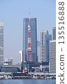 Tokyo Tower and skyscrapers in the city center under the blue sky 135516888
