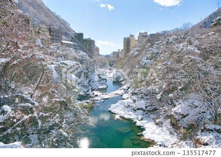 Kinugawa Onsen and Kinugawa River covered in snow in Nikko, Tochigi Prefecture 135517477