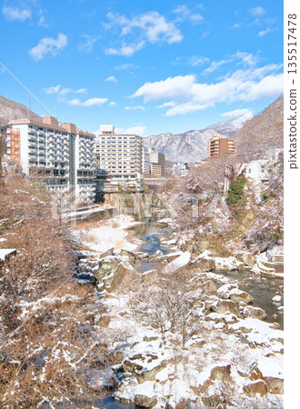 Kinugawa Onsen and Kinugawa River covered in snow in Nikko, Tochigi Prefecture 135517478