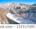 Kinugawa Onsen and Kinugawa River covered in snow in Nikko, Tochigi Prefecture 135517485