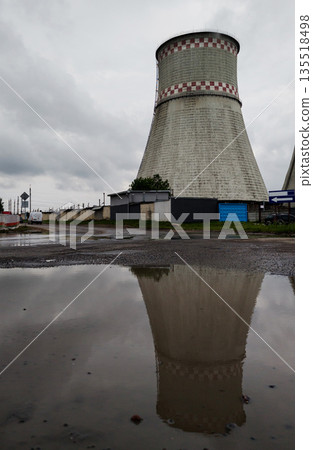 cooling tower against a gray sky 135518498