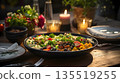 Candlelit salad on a dining table 135519255