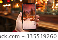 Smartphone screen showing winter scenery 135519260