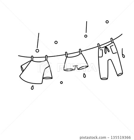 A line of clothes hanging on a clothesline A line of clothes hanging on a clothesline 135519366