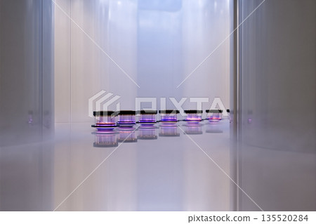 Biotech Incubator Shows Glowing Cultures in Transparent Container at Modern Lab 135520284