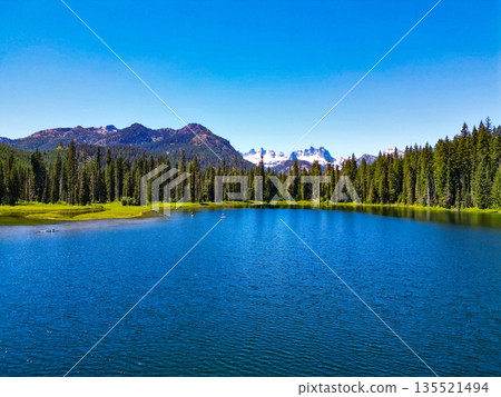 Cooper lake with mountain landscape. Landscape of mountain and forest of Cooper lake. Nature landscape. Cooper Lake in Washington. Scenic nature of popular hiking Cooper lake 135521494