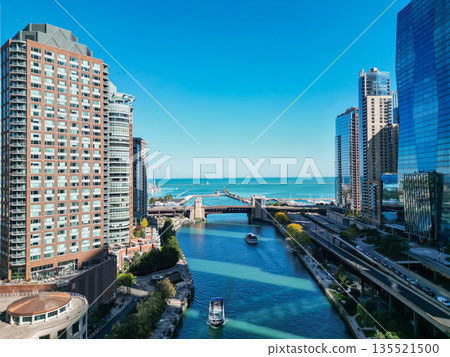 Chicago, USA - October 08, 2024: City cityscape. Cityscape with skyscraper building. Downtown architecture and river. Chicago River in City. Chicago city downtown. Skyscraper architecture. Riverwalk Chicago, USA - October 08, 2024: City cityscape. Cityscape with skyscraper building. Downtown architecture and river. Chicago River in City. Chicago city downtown. Skyscraper architecture. Riverwalk 135521500