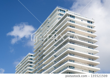 Architecture design of modern building. Perspective residential skyscraper. Modern skyscraper building. Architectural building in Miami beach. Skyscraper perspective view. Hotel architecture Architecture design of modern building. Perspective residential skyscraper. Modern skyscraper building. Architectural building in Miami beach. Skyscraper perspective view. Hotel architecture 135521509