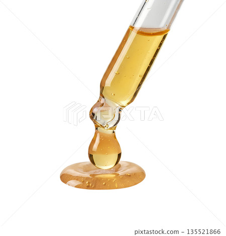 Glass pipette releasing a single drop of shimmering golden liquid, isolated. Represents precision, luxury skincare, science, and valuable essences 135521866