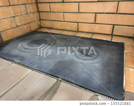 A cooking surface for a heating stove. A cast iron plate with rings for cookware of different sizes. A cooking surface for a heating stove. A cast iron plate with rings for cookware of different sizes. 135521881