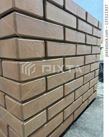 Fresh brickwork of a heating stove. Close-up. Fresh brickwork of a heating stove. Close-up. 135521937