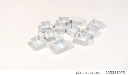 New empty white cuvettes for watercolor paints isolated on white background. Art supplies collection for painting. Back to school. New empty white cuvettes for watercolor paints isolated on white background. Art supplies collection for painting. Back to school. 135521955