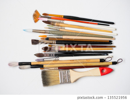 Different watercolor brushes collection isolated on white background, art supplies collection for painting, different sizes and shapes. 135521956