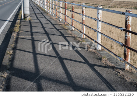 Rusty sidewalk guardrail Rusty sidewalk guardrail 135522120