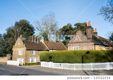 Historic brick buildings under bright sunlight in Richmond, a suburb of London Historic brick buildings under bright sunlight in Richmond, a suburb of London 135522214