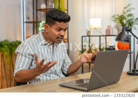 Indian man on video conference argues about work raises voice pushes decision and clear next steps Indian man on video conference argues about work raises voice pushes decision and clear next steps 135522920