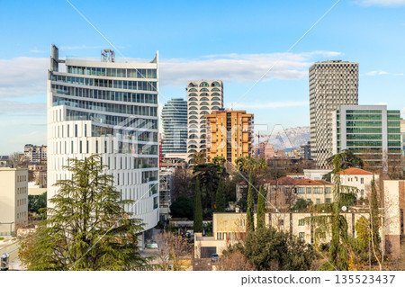 Urban development and modern architecture with tall buildings, city growth and contemporary skyline in Tirana, Albania 135523437