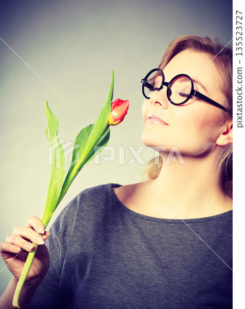 Charming woman smelling flower feel peace. Charming woman smelling flower feel peace. 135523727