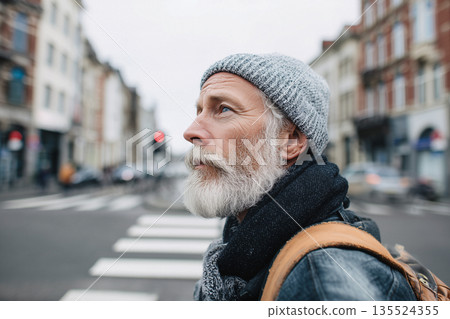 Mature man crossing quiet city street in winter, urban lifestyle concept 135524355