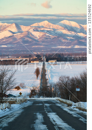 Road leading to the winter mountains Road leading to the winter mountains 135524692