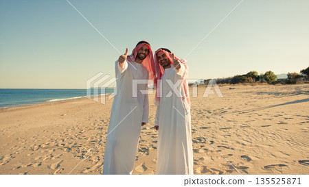 Positive Reaction Of Two Sheiks On The Beach  135525871