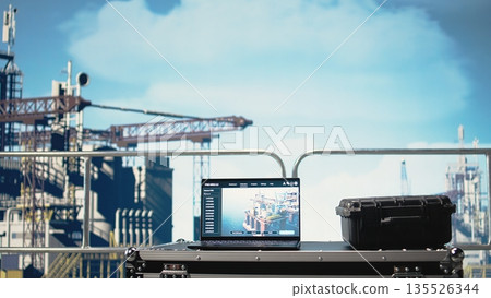 Laptop on drilling barge displaying predictive maintenance dashboard, monitoring machinery. Notebook on offshore platform deck digital analyzing performance metrics, zoom in shot Laptop on drilling barge displaying predictive maintenance dashboard, monitoring machinery. Notebook on offshore platform deck digital analyzing performance metrics, zoom in shot 135526344
