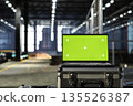 Isolated mockup laptop in empty industrial plant with machinery, fabrication zones and steel components framed by modern infrastructure. Technology integration and design potential. 135526387