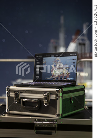 Close up of laptop on ocean drilling ship with digital interface program checking systems. Device on offshore fossil fuel extraction maritime platform with software used for checking machinery Close up of laptop on ocean drilling ship with digital interface program checking systems. Device on offshore fossil fuel extraction maritime platform with software used for checking machinery 135526413