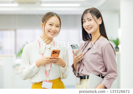 A woman watching a smartphone 135526672