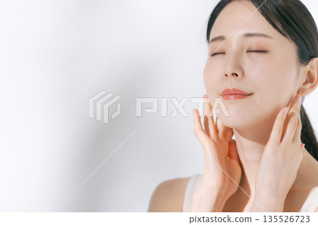 A young woman doing skin care A young woman doing skin care 135526723