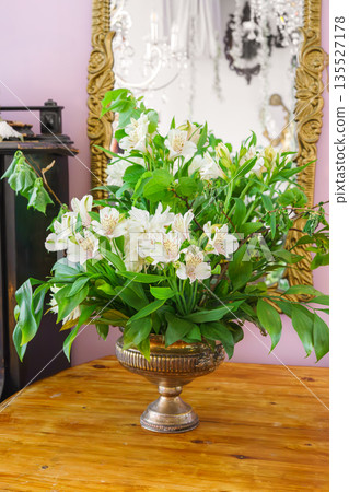 White alstroemeria, peruvian lily flower in vintage vase with mirror and soft pastel interior White alstroemeria, peruvian lily flower in vintage vase with mirror and soft pastel interior 135527178