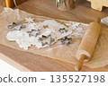 Christmas cookie baking scene with dough, rolling pin and metal cutters for holiday gingerbread 135527198