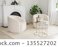 Modern living room with white armchairs and glass coffee table with ice bucket in bright interior 135527202