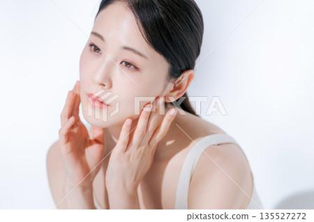 A young lady hitting his cheek A young lady hitting his cheek 135527272