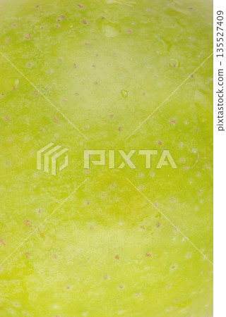 Green apple as a background macro photo texture. Green apple as a background macro photo texture. 135527409