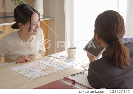 A young woman consulting about insurance and asset formation 135527865