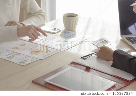 A young woman consulting about insurance and asset formation A young woman consulting about insurance and asset formation 135527884