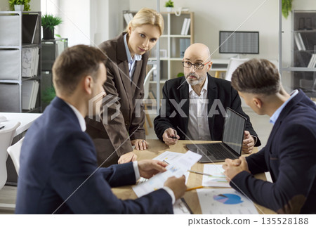 Business team meeting with manager discussing strategy and planning in office Business team meeting with manager discussing strategy and planning in office 135528188