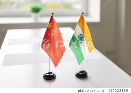 China and India desk flags on meeting table symbolizing bilateral diplomacy China and India desk flags on meeting table symbolizing bilateral diplomacy 135528189