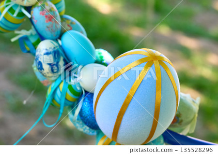 Easter street art.Blue bouquet of colorful painted eggs 135528296