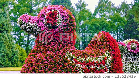 Exquisitely Designed Plant Sculpture With Colorful Petals And Leafy Accents For Decoration Exquisitely Designed Plant Sculpture With Colorful Petals And Leafy Accents For Decoration 135528439