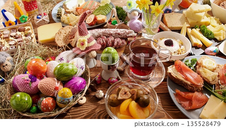 Bright Seasonal Table Setting, Lively Holiday Meal Scene Featuring Decorated Eggs And Sweet Treats 135528479