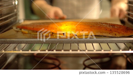 Warm Fresh Baking, Artisan Baker Slides Golden Crusted Pie Into Hot Oven Amidst Cozy Kitchen Ambiance 135528696