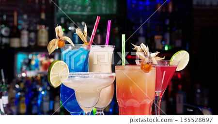 Festive Atmosphere With Vividly Colored Cocktails And Friends Sharing Joyful Summer Moments Festive Atmosphere With Vividly Colored Cocktails And Friends Sharing Joyful Summer Moments 135528697