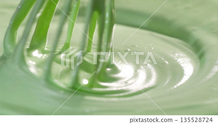 Creamy Matcha Mixture, Chef Mixing Vibrant Green Paste, Silky Smooth Dessert Batter Being Blended Carefully Creamy Matcha Mixture, Chef Mixing Vibrant Green Paste, Silky Smooth Dessert Batter Being Blended Carefully 135528724